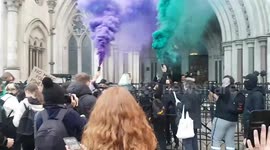 Women's rights campaigners activate dozens of rape alarms at the Royal Courts of Justice
