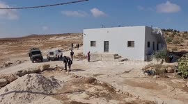 An Israeli bulldozer demolished a Palestinian house under the pretext of building without permits