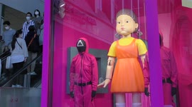 Shoppers in Tokyo’s youth mecca Shibuya stop to take pictures of creepy ‘Squid Game’ attraction