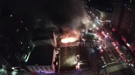 Harlem five-alarm fire blazes through business