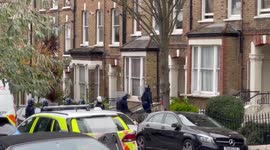 Man threatening to jump out of window in Islington