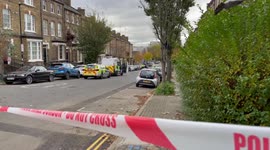 Man threatening to jump out of window in Islington