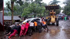 Clean-up operation begins as flash floods leave Indonesia ravaged