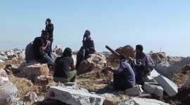 Palestinians asess the ruins of a mosque after it was reportedly demolished by the Israeli army