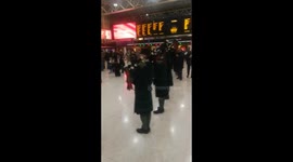 Pipe down! Bagpipe band plays at London's Charing Cross station