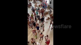 Cancun resort guests take shelter after rival drug gangs open fire by beach