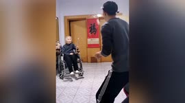 83-year-old woman uses kitchen tools in table tennis match with son in China