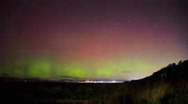 Northern Lights swirl mesmerisingly in skies above Scottish beach