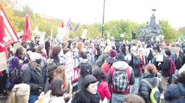 Large crowd of socialist protestors hold signs and chant loudly at COP26 Protests at Glasgow 2021 United Kingdom