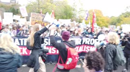 Dancing Large crowd of socialist protestors hold banners and signs and chant loudly at COP26 Protests at Glasgow 2021 United Kingdom