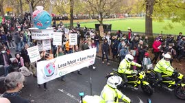 Less Meat Less Heat protestors holding banner and chanting at COP26 Protests at Glasgow 2021 United Kingdom