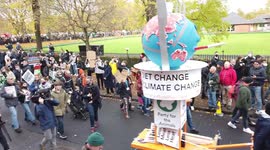 Newsflare Edit - Less Meat Less Heat protestors holding banner and chanting at COP26 Protests at Glasgow 2021 United Kingdom