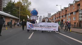 Protesters at Glasgow COP26 on Friday Hold Banner Saying