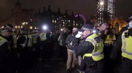 Policewoman hit in head by plastic bottle during ugly scenes at ‘Million Mask March' in London