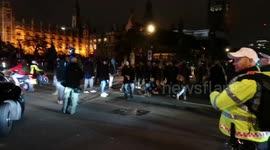 Million Mask Protestors In Parlimeant Square Stop Traffic And Cause Chaos In Westminster