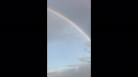Portrait version of rainbow near the waterways video