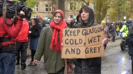 Rain and high winds fail to stop 200,000 climate change protesters marching in Glasgow