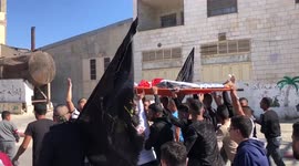 Palestinians mourn boy who was killed by Israeli forces during clashes
