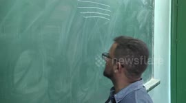 Gazan Teacher Combines art with Education by taking on the role of the clown.