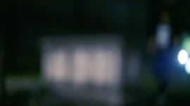 Guy in a graveyard on Halloween with a beer