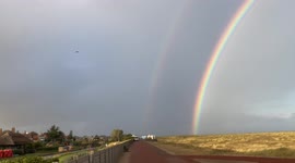 Amazing double rainbow arching over waterways of Great Yarmouth