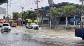 Bangkok roads flooded as city’s river overflows following rainstorm