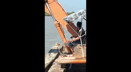 You'll dig this! Excavator drivers use mechanical arms to row ferries
