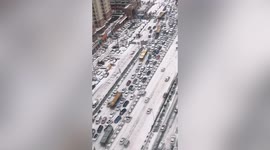 Snow causes havoc as hundreds of vehicles left stranded on highway in northern China