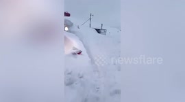 Locals open their doors to huge walls of record-breaking snow in northern China