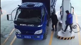 Man accidentally douses colleague in petrol at self-service gas station in China