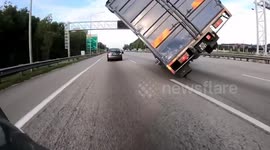Truck flips over in Malaysian expressway after driver ‘falls asleep'