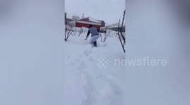 Nurses struggle to walk to hospital through snow-covered road in northern China