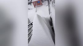 Mountain of snow piles up on stairs after record-breaking blizzard hits northern China