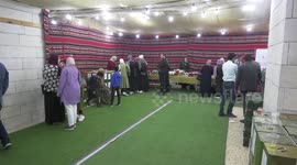 Palestinians participate in an exhibition of olive products and olive oil