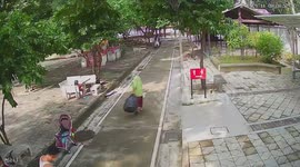 Scary moment floodwater emerges on temple pathway in Thailand