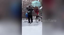 Chinese vendor dances on snow-covered ground to attract customers
