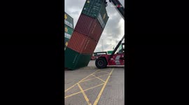 'Heavy shipping containers almost crush the loading machine after it malfunctions'