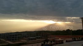Tyndall effect creates beautiful sunset over city in China