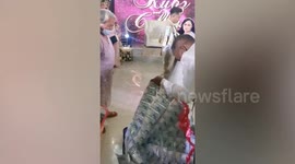 Newlywed couple receives a million pesos in cash during their money dance in the Philippines