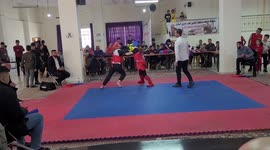 Palestinian youth fight during Wushu (Kung Fu) championship, in the West Bank city of Hebron