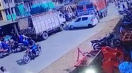Truck crashes into car amid street in central India