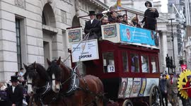 Paraders waving to spectators during the Lord Mayor's Show 2021 at Bank of England