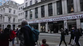 Huge banner that says 'The Mercer's Company welcomes the New Lord Mayor' hung on wall