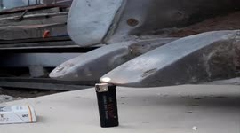 Insane precision as worker flicks lighter with excavator