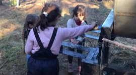 Rare video from Belarus-Poland border shows children among the migrants enduring harsh winter conditions