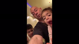 Siblings' contrasting reactions to dad's funny Halloween candy prank
