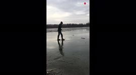 Daring or stupid? Man partially falls through frozen lake after walking on thin ice