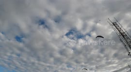 Amazing paragliders flying in a beautiful day in Vila Velha at Morro do Moreno