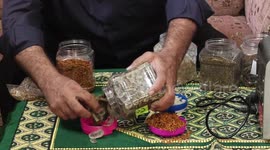 A Palestinian specialist in alternative medicine, Jamal Inaya, 60, displays the natural herbs at a small clinic in his home