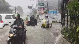 Dozens of motorbikes almost swept away by powerful floodwaters in West Java